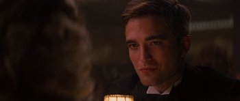 Movie still from “Water for Elephants” (2011), directed by Francis Lawrence – A person holding a lit candle; Close Up shot, Over the shoulder angle