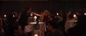 Movie still from “Water for Elephants” (2011), directed by Francis Lawrence – A group of people sitting at a table in a restaurant; Medium shot, Over the shoulder angle