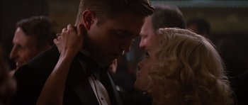 Movie still from “Water for Elephants” (2011), directed by Francis Lawrence – A man and a woman in formal wear looking at each other; Close Up shot, Over the shoulder angle
