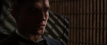 Movie still from “Water for Elephants” (2011), directed by Francis Lawrence – A man's face in a dark room; Close Up shot, High angle