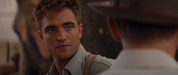Movie still from “Water for Elephants” (2011), directed by Francis Lawrence – A person wearing a hat looking at a man; Close Up shot, Over the shoulder angle