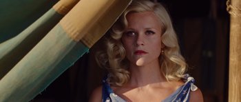 Movie still from “Water for Elephants” (2011), directed by Francis Lawrence – A woman with blonde curly hair holding an umbrella; Close Up shot, Low angle