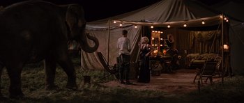 Movie still from “Water for Elephants” (2011), directed by Francis Lawrence – A man and a woman standing in front of an elephant; Wide shot, Over the shoulder angle