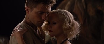 Movie still from “Water for Elephants” (2011), directed by Francis Lawrence – A man and a woman looking into each others eyes; Close Up shot, Low angle