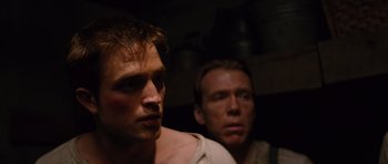 Movie still from “Water for Elephants” (2011), directed by Francis Lawrence – Two men are standing next to each other; Close Up shot, High angle