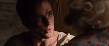 Movie still from “Water for Elephants” (2011), directed by Francis Lawrence – A person looking at a mirror; Close Up shot, Over the shoulder angle