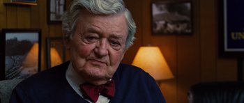 Movie still from “Water for Elephants” (2011), directed by Francis Lawrence – An older man wearing a red bow tie; Close Up shot, Over the shoulder angle