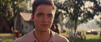 Movie still from “Water for Elephants” (2011), directed by Francis Lawrence – A person wearing a pink shirt; Close Up shot, Over the shoulder angle