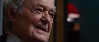 Movie still from “Water for Elephants” (2011), directed by Francis Lawrence – An older man with a white beard looking into the distance; Close Up shot, Over the shoulder angle