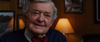 Movie still from “Water for Elephants” (2011), directed by Francis Lawrence – An older man wearing a red bow tie; Close Up shot, Over the shoulder angle