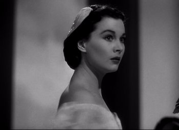 Movie still from “Waterloo Bridge” (1940), directed by Mervyn LeRoy – A black - and - white photo of a woman wearing a hat; Close Up shot, Low angle