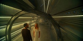 Movie still from “Another Life” (2019), created by Aaron Martin – A man and a woman are standing in a tunnel; Wide shot, High angle