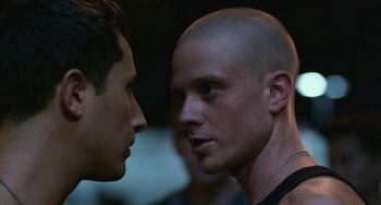 Movie still from “We Are Your Friends” (2015), directed by Max Joseph – Two men face to face in a dark room; Close Up shot, Over the shoulder angle