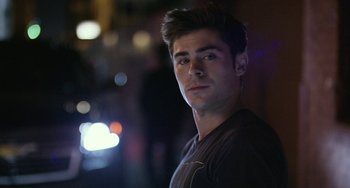 Movie still from “We Are Your Friends” (2015), directed by Max Joseph – A young man is posing for a picture; Close Up shot, Over the shoulder angle