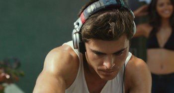 Movie still from “We Are Your Friends” (2015), directed by Max Joseph – A person with headphones on; Close Up shot, Low angle