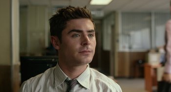 Movie still from “We Are Your Friends” (2015), directed by Max Joseph – A man in a striped dress shirt and a tie; Close Up shot, Over the shoulder angle