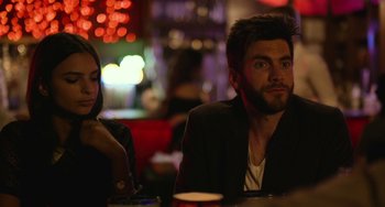 Movie still from “We Are Your Friends” (2015), directed by Max Joseph – A man and a woman sitting at a table in a restaurant; Close Up shot, Over the shoulder angle