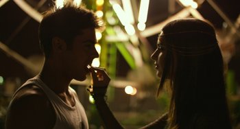 Movie still from “We Are Your Friends” (2015), directed by Max Joseph – A man and a woman standing next to each other; Close Up shot, Over the shoulder angle