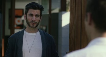Movie still from “We Are Your Friends” (2015), directed by Max Joseph – A person with a beard; Close Up shot, Over the shoulder angle