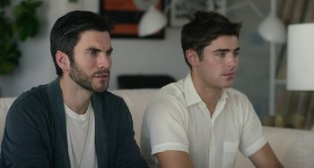 Movie still from “We Are Your Friends” (2015), directed by Max Joseph – Two young men sitting on a couch looking at something; Close Up shot, Over the shoulder angle