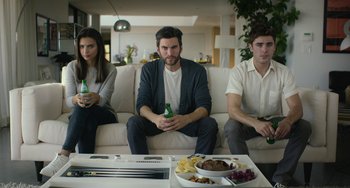 Movie still from “We Are Your Friends” (2015), directed by Max Joseph – A group of people sitting on top of a white couch; Medium shot, High angle
