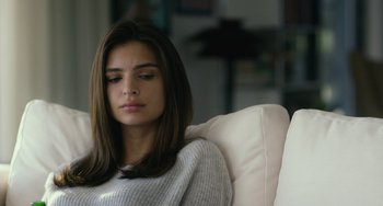 Movie still from “We Are Your Friends” (2015), directed by Max Joseph – A beautiful young woman sitting on a couch; Close Up shot, Over the shoulder angle