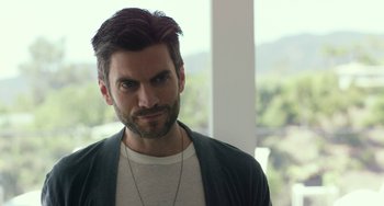 Movie still from “We Are Your Friends” (2015), directed by Max Joseph – A person with a beard; Close Up shot, Over the shoulder angle