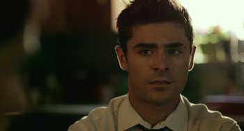Movie still from “We Are Your Friends” (2015), directed by Max Joseph – A person wearing a shirt and tie; Close Up shot, Over the shoulder angle