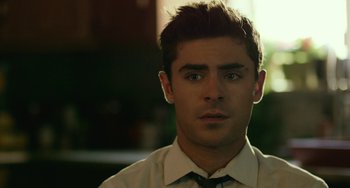 Movie still from “We Are Your Friends” (2015), directed by Max Joseph – A person wearing a shirt and tie; Close Up shot, Over the shoulder angle