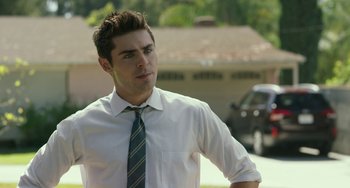Movie still from “We Are Your Friends” (2015), directed by Max Joseph – A man wearing a white shirt and a blue tie; Medium shot, Over the shoulder angle