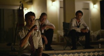 Movie still from “We Are Your Friends” (2015), directed by Max Joseph – A group of men sitting next to each other; Medium shot, Low angle