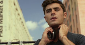 Movie still from “We Are Your Friends” (2015), directed by Max Joseph – A person with headphones on; Close Up shot, Low angle