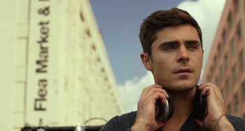 Movie still from “We Are Your Friends” (2015), directed by Max Joseph – A man holding a phone up to his ear; Close Up shot, Low angle