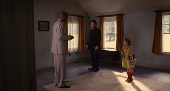 Movie still from “We Bought a Zoo” (2011), directed by Cameron Crowe – Two men and a woman standing in a living room; Wide shot, Over the shoulder angle