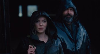 Movie still from “We Bought a Zoo” (2011), directed by Cameron Crowe – A woman and a bearded man wearing rain jackets; Close Up shot, Low angle
