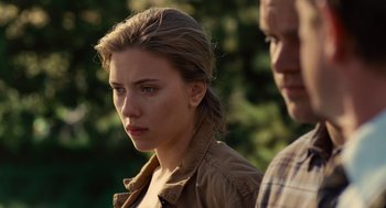 Movie still from “We Bought a Zoo” (2011), directed by Cameron Crowe – A woman with a brown shirt is looking at the camera; Close Up shot, Over the shoulder angle