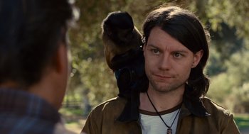 Movie still from “We Bought a Zoo” (2011), directed by Cameron Crowe – A man holding a monkey on his shoulder; Close Up shot, Over the shoulder angle