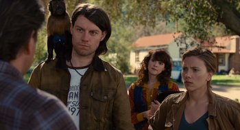 Movie still from “We Bought a Zoo” (2011), directed by Cameron Crowe – A group of people standing next to each other on a street; Medium shot, Over the shoulder angle