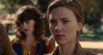 Movie still from “We Bought a Zoo” (2011), directed by Cameron Crowe – A woman with blue eyes is looking at the camera; Close Up shot, Over the shoulder angle