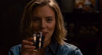 Movie still from “We Bought a Zoo” (2011), directed by Cameron Crowe – A woman holding a glass of beer in her hand; Close Up shot, Over the shoulder angle