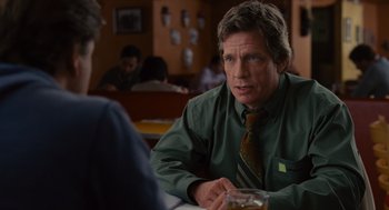 Movie still from “We Bought a Zoo” (2011), directed by Cameron Crowe – A man sitting at a table in front of another man; Close Up shot, Over the shoulder angle