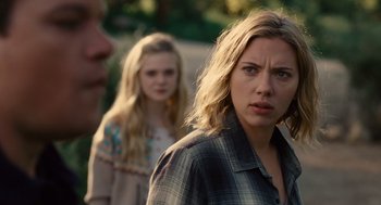 Movie still from “We Bought a Zoo” (2011), directed by Cameron Crowe – Two women and a man in plaid shirts; Close Up shot, Over the shoulder angle