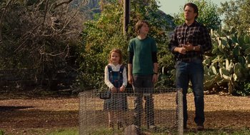 Movie still from “We Bought a Zoo” (2011), directed by Cameron Crowe – A group of people standing next to each other in a field; Wide shot, Low angle