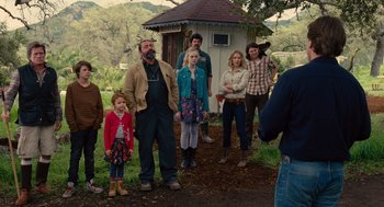 Movie still from “We Bought a Zoo” (2011), directed by Cameron Crowe – A group of people standing in front of a building; Wide shot, Over the shoulder angle