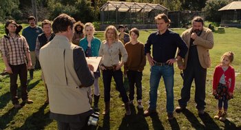 Movie still from “We Bought a Zoo” (2011), directed by Cameron Crowe – A group of people standing in the grass; Medium shot, Over the shoulder angle