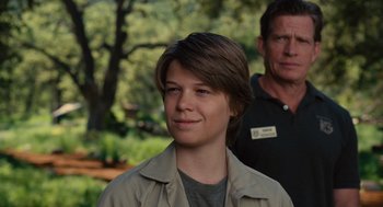 Movie still from “We Bought a Zoo” (2011), directed by Cameron Crowe – A man and a woman standing next to each other in a park; Close Up shot, Over the shoulder angle