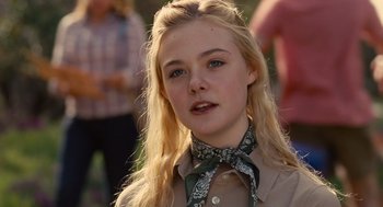 Movie still from “We Bought a Zoo” (2011), directed by Cameron Crowe – A young woman with long blonde hair wearing a neck scarf; Close Up shot, Over the shoulder angle