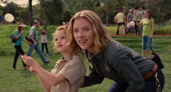 Movie still from “We Bought a Zoo” (2011), directed by Cameron Crowe – A woman and a girl are posing for a picture; Medium shot, Over the shoulder angle