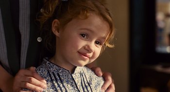 Movie still from “We Bought a Zoo” (2011), directed by Cameron Crowe – A young girl with her hands on her chest; Close Up shot, Over the shoulder angle