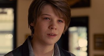 Movie still from “We Bought a Zoo” (2011), directed by Cameron Crowe – A person with short brown hair; Close Up shot, Over the shoulder angle